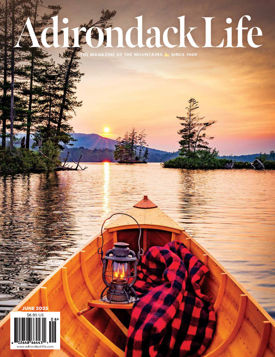 Adirondack Life cover featuring a canoe on a lake